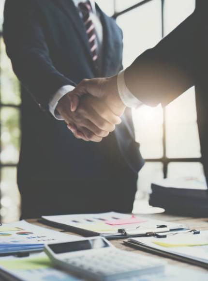 istockphoto-1455705262-612×612 Business partnership meeting concept. Image businessmans handshake. Successful businessmen handshaking after good deal. Group support concept